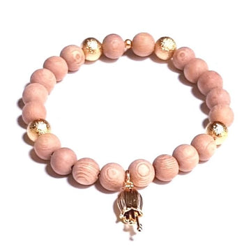 Handmade Golden Flower Bracelet – Rosewood & Gold for Balance & Prosperity on white table with Gold Flower Charm